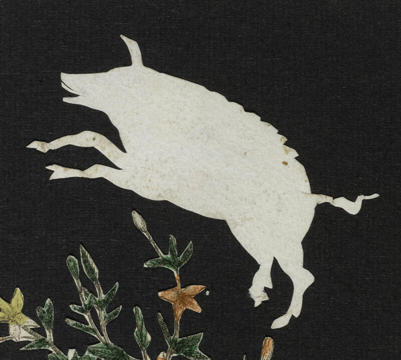 A little pig hanging from the ceiling